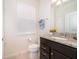 Simple bathroom with granite countertop and a toilet at 1230 Aloha Blvd, Davenport, FL 33897