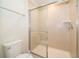Clean bathroom with a shower and toilet at 1230 Aloha Blvd, Davenport, FL 33897