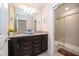 Bathroom with a double vanity and shower at 1230 Aloha Blvd, Davenport, FL 33897