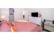 Bright bedroom with a comfortable bed, dresser, and large closet at 1230 Aloha Blvd, Davenport, FL 33897