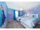 bedroom with twin beds and Frozen mural at 1230 Aloha Blvd, Davenport, FL 33897