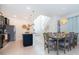 Kitchen and dining area with island and modern dining table at 1230 Aloha Blvd, Davenport, FL 33897
