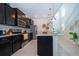 Spacious kitchen boasts dark cabinetry and granite countertops at 1230 Aloha Blvd, Davenport, FL 33897