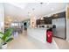 Modern kitchen with dark cabinets and granite countertops at 1230 Aloha Blvd, Davenport, FL 33897