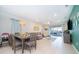 Open living area with L-shaped sofa, and access to backyard patio at 1230 Aloha Blvd, Davenport, FL 33897