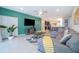 Living area with sectional sofa, large TV and access to backyard at 1230 Aloha Blvd, Davenport, FL 33897