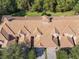 Aerial view of multiple townhouses with Spanish tile roofs at 1300 Gilford Point Ln # 1300, Davenport, FL 33896