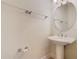 Clean bathroom with pedestal sink and large vanity mirror at 1300 Gilford Point Ln # 1300, Davenport, FL 33896