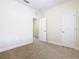 Bedroom with neutral walls, carpet, and double door closet at 1300 Gilford Point Ln # 1300, Davenport, FL 33896