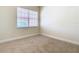Well-lit bedroom with large window and neutral wall at 1300 Gilford Point Ln # 1300, Davenport, FL 33896