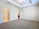 Spacious bedroom with carpet and access to bathroom at 1300 Gilford Point Ln # 1300, Davenport, FL 33896