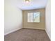 Bright bedroom featuring neutral walls and carpeted floors at 1300 Gilford Point Ln # 1300, Davenport, FL 33896