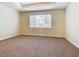 Bright bedroom with window and neutral decor at 1300 Gilford Point Ln # 1300, Davenport, FL 33896