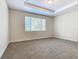 Bright bedroom featuring a large window and carpet at 1300 Gilford Point Ln # 1300, Davenport, FL 33896