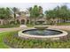 Community center with fountain and landscaped grounds at 1300 Gilford Point Ln # 1300, Davenport, FL 33896