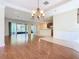 Bright dining area with hardwood floors and chandelier at 1300 Gilford Point Ln # 1300, Davenport, FL 33896