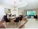 Elegant dining room featuring a marble table and dark chairs at 1300 Gilford Point Ln # 1300, Davenport, FL 33896