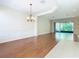 Spacious dining room with hardwood floors and access to the living room at 1300 Gilford Point Ln # 1300, Davenport, FL 33896