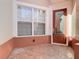 Inviting front entry with brick flooring, a large window, and a wood door at 1300 Gilford Point Ln # 1300, Davenport, FL 33896