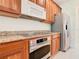 Stainless steel appliances and granite countertops in this kitchen at 1300 Gilford Point Ln # 1300, Davenport, FL 33896