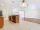 Open kitchen with island and views into living room at 1300 Gilford Point Ln # 1300, Davenport, FL 33896