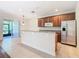 Kitchen with stainless steel appliances and wood cabinets at 1300 Gilford Point Ln # 1300, Davenport, FL 33896