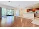 Living room with kitchen and access to a screened patio at 1300 Gilford Point Ln # 1300, Davenport, FL 33896