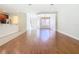 Hardwood floor living room, open to kitchen and dining areas at 1300 Gilford Point Ln # 1300, Davenport, FL 33896