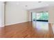 Living room with hardwood floors and sliding doors to patio at 1300 Gilford Point Ln # 1300, Davenport, FL 33896