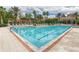 Resort-style community pool with plenty of lounge chairs at 1300 Gilford Point Ln # 1300, Davenport, FL 33896