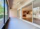Covered porch with access to kitchen and backyard at 1300 Gilford Point Ln # 1300, Davenport, FL 33896