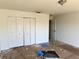 Spacious bedroom with white closet doors and carpeting at 15443 Perdido Dr, Orlando, FL 32828