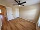 Spacious bedroom with double door closet and wood-look flooring at 1618 J Lawson Blvd, Orlando, FL 32824