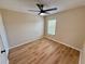 Bright bedroom with ceiling fan and light wood flooring at 1618 J Lawson Blvd, Orlando, FL 32824