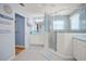 Spa-like bathroom with double sinks and a large walk-in shower at 19430 Sarmundham St, Orlando, FL 32833