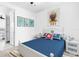 Nautical themed bedroom with a white and blue bed and matching furniture at 2097 Celebration Blvd, Celebration, FL 34747