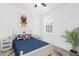 A well-lit bedroom with a blue and white bed and nautical touches at 2097 Celebration Blvd, Celebration, FL 34747