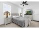 Cozy bedroom featuring a queen-sized bed, nightstands, and matching dresser at 2097 Celebration Blvd, Celebration, FL 34747
