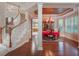 Elegant dining room with red tablecloth, chandelier, and view of the kitchen at 25629 Hawks Run Ln, Sorrento, FL 32776