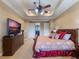 Spacious main bedroom with ceiling fan, walk-in closet, and ensuite bathroom at 25629 Hawks Run Ln, Sorrento, FL 32776