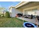 Covered patio with seating area, grill, and trampoline at 3359 Hanging Tide St, Winter Garden, FL 34787