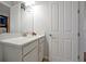 Bathroom with white vanity and granite countertop at 3359 Hanging Tide St, Winter Garden, FL 34787