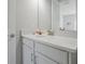 Small bathroom with white vanity and granite countertop at 3359 Hanging Tide St, Winter Garden, FL 34787
