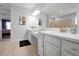 Bright bathroom features double vanity with quartz countertop at 3359 Hanging Tide St, Winter Garden, FL 34787