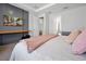 Spacious bedroom with cozy bedding and built-in desk at 3359 Hanging Tide St, Winter Garden, FL 34787