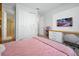 Well-lit bedroom with a built-in desk and storage at 3359 Hanging Tide St, Winter Garden, FL 34787