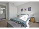 Serene bedroom with star bedding and adjacent bathroom at 3359 Hanging Tide St, Winter Garden, FL 34787