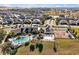 Community pool, playground, and clubhouse with palm trees at 3359 Hanging Tide St, Winter Garden, FL 34787