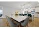 Bright dining area with white table and green chairs at 3359 Hanging Tide St, Winter Garden, FL 34787