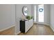 Bright entryway with wood-look floors and a modern console table at 3359 Hanging Tide St, Winter Garden, FL 34787